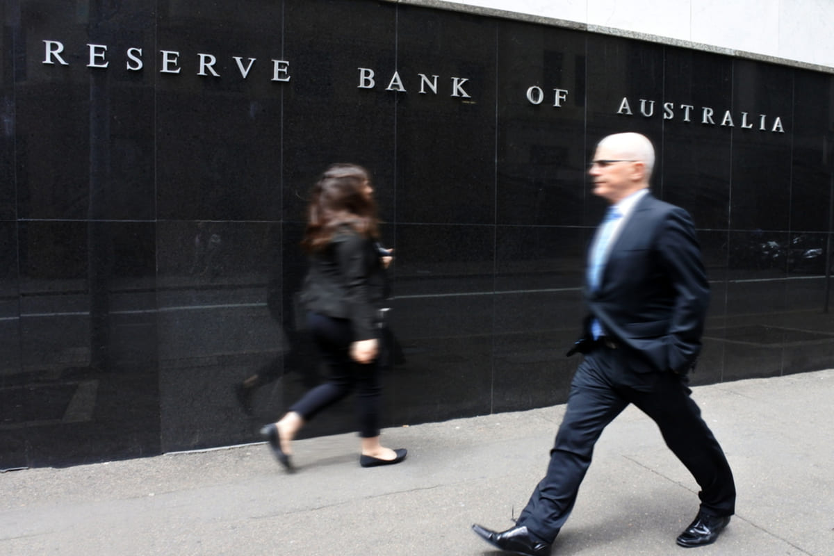 Australia’s central bank lowers rates by 25 basis points, revising economic growth forecast to 1.7 percent 