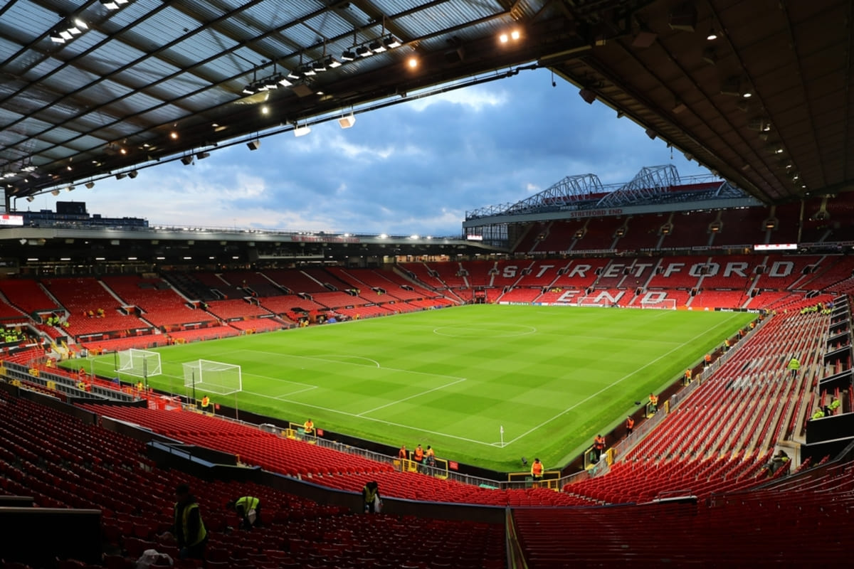 Manchester United’s proposed stadium-led regeneration has advanced from an assessment of two competing options to a plan for a new 100,000-seat arena beside Old Trafford, supported by a wider mixed-use district.An economic feasibility study commissioned by the Premier League club estimated that regenerating the Old Trafford area could contribute GBP7.3 billion, equivalent at the time to about $9.82 billion, to the British economy every year.When the study was released in September 2024, Manchester United was considering either building a new stadium for an estimated GBP2 billion or redeveloping Old Trafford, which had a capacity of approximately 74,000.Greater Manchester Mayor Andy Burnham supported the wider regeneration ambition but said public money would not be used to build the stadium.The surrounding neighborhood was envisioned as a mixed-use development incorporating homes, shopping centers, public spaces and new transport stations.Economic impact forecastGlobal advisory firm Oxford Economics estimated that the regeneration program could support 92,000 new jobs, deliver more than 17,000 homes and attract an additional 1.8 million visitors to the area each year.Burnham said the development had the potential to become the largest regeneration project he had seen in Britain.He expressed hope that the project would deliver the world’s best football stadium while ensuring that the surrounding community benefited from the investment.The plan was led by Manchester United co-owner Sir Jim Ratcliffe, the British billionaire who acquired a minority stake in the club in February 2024.Ratcliffe had initially raised the possibility of seeking government assistance for what he described as a “Wembley of the North.” However, Burnham’s comments indicated that the stadium itself would need to be financed privately.Manchester United appointed Foster + Partners in September 2024 to prepare a master plan for the stadium and surrounding district.The club also consulted supporters about the available options. Former Manchester United captain Gary Neville, who served on the Old Trafford Regeneration Task Force, encouraged fans to participate and share their views.New stadium chosenManchester United subsequently confirmed in March 2025 that it intended to pursue a new 100,000-seat stadium instead of redeveloping the existing ground.The proposed arena would be built next to Old Trafford and become Britain’s largest football stadium. The club estimated that construction could be completed within five years.According to the stadium announcement reported by Reuters, the venue would have a gross capacity of 104,000, placing it behind only Barcelona’s expanded Camp Nou among European football stadiums.The design produced by Foster + Partners includes a large umbrella-style canopy covering the stadium and a public plaza twice the size of London’s Trafalgar Square.Three masts would form the venue’s most recognizable architectural feature. The tallest would reach 200 meters, exceeding the height of Manchester’s 169-meter Beetham Tower and Wembley Stadium’s 135-meter arch.The club said the structure could be visible from as far as 37.4 kilometers away under favorable conditions, including parts of Cheshire, the Peak District and the outskirts of Liverpool.Faster construction plannedFoster + Partners proposed using prefabricated sections to reduce the normal stadium construction period. Components could be transported through the Manchester Ship Canal, reconnecting the project with the area’s industrial and maritime heritage.The stadium canopy is designed to collect rainwater and generate energy while protecting a new public plaza and surrounding commercial spaces.Foster + Partners said the fan experience would remain central to the design, with seating intended to bring spectators closer to the pitch and improve the stadium’s acoustics and atmosphere.The new venue would replace Old Trafford as Manchester United’s principal home. Old Trafford has hosted the club since 1910 and was rebuilt after sustaining extensive damage during the Second World War.The stadium underwent major expansions during the 1990s and 2000s but has not received a significant redevelopment since 2006. Concerns about its condition have grown following roof leaks, drainage problems and reported rodent sightings.Manchester United has also fallen behind newer Premier League venues in its ability to host concerts, corporate events and other activities outside matchdays.Wider district advancesTrafford Council backed the regeneration program in January 2025 and approved work to establish a sustainable international destination around the stadium, Manchester Ship Canal and Imperial War Museum North.The wider plan was expected at that stage to support around 48,000 local jobs, deliver approximately 15,000 homes and contribute GBP4.2 billion to the regional economy. These planning estimates used a different geographic scope and methodology from the Oxford Economics figures of 92,000 jobs, 17,000 homes and GBP7.3 billion in annual national economic value.British Chancellor Rachel Reeves also backed the regeneration concept, viewing the project as a potential driver of economic growth in Greater Manchester.The public sector’s role is focused on the surrounding district, transport connections, land assembly and infrastructure rather than paying for the football stadium.In June 2026, Manchester United reached another major milestone by securing most of the land required for the new venue.The club acquired the majority of a 25-acre site from industrial property company Indurent, providing space for the stadium approximately 350 meters northwest of Old Trafford.The land deal allowed the club to advance its plans without relying on the neighboring Freightliner rail terminal, where earlier negotiations had encountered disagreements over the site’s value.Read more: Saudi Arabia, U.S. turn 2026 and 2034 World Cups into investment platform spanning 15 stadiums across five citiesLand deal securedManchester United’s official land announcement described the stadium as the centerpiece of a 370-acre regeneration project.The latest framework is expected to deliver around 15,000 homes, including affordable housing, create approximately 48,000 jobs locally and more than 90,000 nationally, and contribute more than GBP7 billion annually to the United Kingdom’s economy.The club said the new site would allow it to preserve Old Trafford’s heritage and matchday traditions while creating a modern venue with improved facilities, accessibility and supporter experiences.Securing the land does not by itself authorize construction. The development still requires detailed design work, public consultation, planning permission, financing and coordination with local and national authorities.The final future of the existing Old Trafford stadium also remains undecided. Options could include retaining part of the ground, adapting it for another use or incorporating its heritage into the wider regeneration district.Financing remains centralThe proposed new stadium has been widely estimated to cost around GBP2 billion, although the final amount will depend on design decisions, construction costs, infrastructure requirements and the project’s financing structure.The scale of the investment presents a financial challenge for Manchester United. When the detailed plans were announced in 2025, the club’s liabilities, including outstanding transfer payments, exceeded GBP1 billion.Chief Executive Omar Berrada has acknowledged that stadium investment could affect spending in other areas, including the playing squad, during the construction period.The project’s commercial case depends partly on the increased capacity and the stadium’s ability to host events throughout the year. Additional hospitality areas, concerts, retail, dining, tourism and corporate activities could generate revenue beyond Premier League and European football matches.The wider regeneration would also need substantial investment in public transport, pedestrian routes, utilities, roads and community facilities to accommodate residents, workers and millions of additional visitors.Manchester United stadium regeneration